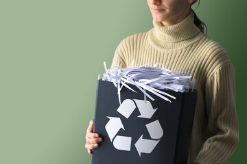 Woman holding a box full of paper. recycling, waste sorting and sustainability concept - happy...