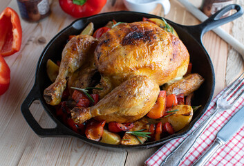 Roasted chicken with potatoes and bell peppers