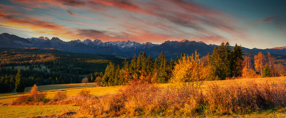 Beautiful sunrise on the meadow under the Tatra Mountains at autumn. Poland © Patryk Kosmider