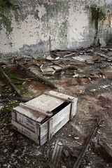 Wooden crate in an abandoned, derelict building