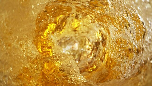 Super slow motion of pouring beer in twister shape. Filmed on high speed cinema camera 1000 fps. Ultimate inside bottle view filmed with special wide angle macro lens.