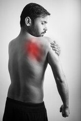 red highlight on shoulder blade or scapula showing pain in body part