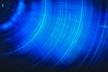 Blue abstract background with spiral pattern. Galaxies with stars and planets with circular motifs in deep blue lines of the universe night light space. No render.