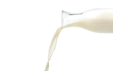 Pouring fresh milk from the bottle isolated on white background.