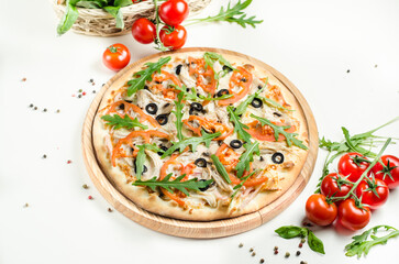 Pizza with mushrooms, tomatoes, ham, olives and arugula