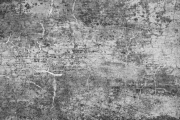 Old grunge dirty textured cement wall surface. With uneven stains and tiny holes.