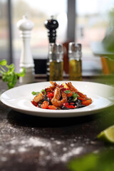 Black tagliatelle pasta with seafood. Pasta with seafood.
Appetizing dish on a plate, culinary photography. Food background.
