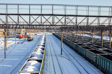 Railway station in the city of Shadrinsk, Kurgan region in Russia. View of the railway tracks and wagons from the bridge at the station.