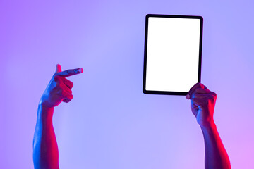 Tablet screen mockup. Cropped view of black man pointing at blank touch pad, recommending new app...