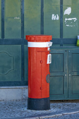 English type letterbox on a street in Tavira, Algarve, Portugal.
