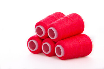 Red spool of thread isolated on white background. Skein of woolen threads. Yarn for knitting....