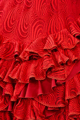 Flamenco dress outfit detail, red color. Elegant spanish woman clothing