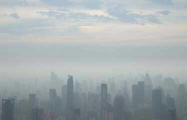 PM 2.5 fog and dust in a city crowded with buildings.