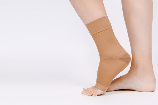 Orthopedic Ankle Brace. Medical Ankle Bandage. Medical Ankle Support Strap Adjustable Wrap Bandage Brace foot Pain Relief Sport. Leg Brace isolated on white background. Trauma Ankle orthosis. Injury
