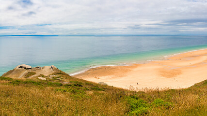Scene of beach side with cloudy sky, saturated colors