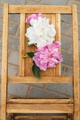 wooden background and peonies 