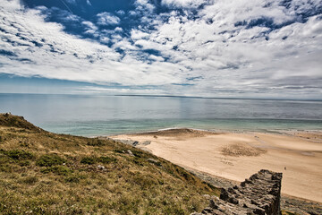 Scene of beach side with cloudy sky, saturated colors