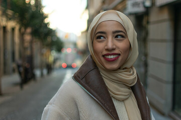 Portrait of Burnett Muslim girl cover her head with scarf or burka