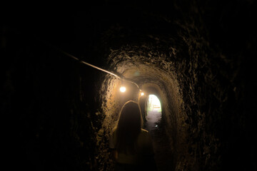 Girl venturing into gold mines in Ouro Preto - MG