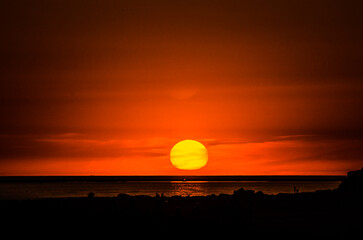 Beautiful views of the multi-colored sunset on the beach of Conil de la Frontera, Cadiz