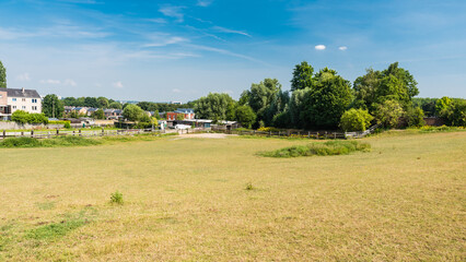  Molenbeek, Brussels / Belgium - 07 20 2018: Scenic view over dry grass meadows in the city suburbs in summer