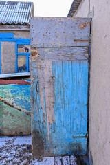 vintage wooden door. old wooden door with peeling paint. barn door.