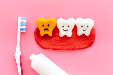 Oral health and care concept - clean teeth models with toothbrush