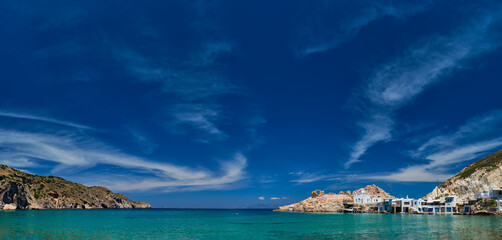 Panorama of the beach and fishing village of Firapotamos in Milos island, Greece