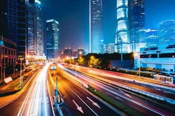 Fototapeta premium the light trails on the modern building background in shanghai china.