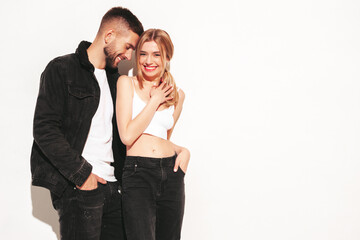 Sexy smiling beautiful woman and her handsome boyfriend. Happy cheerful family having tender moments.Young passionate couple hugging. Sensual pair isolated on white. Cheerful and happy