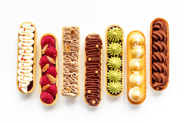 Sweet food pattern of eclairs with color topping. Sweet shacks