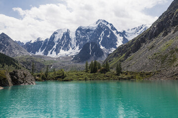 Naklejka na ściany i meble Beautiful mountain landscape with a clear lake and rocks