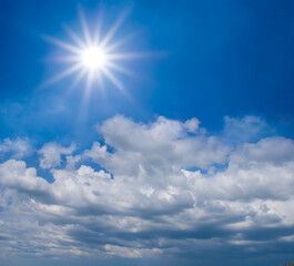 Naklejka na ściany i meble sparkle sun on dense cloudy sky background