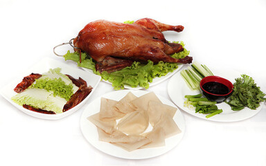 Traditional served Peking duck on white background