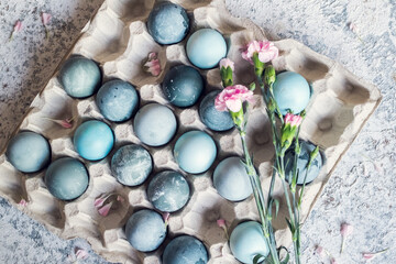 Blue Easter eggs painted with natural dye red cabbage