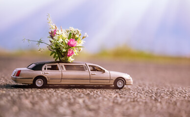 Toy car with a bouquet of flowers