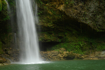 Fototapeta na wymiar Fabulous wild jungle cascade in espanola island