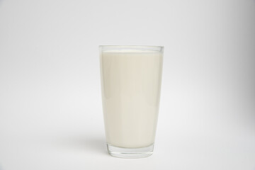 Milk glass closeup on white background