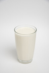 Milk glass closeup on white background