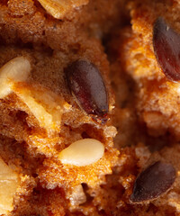 Sesame seeds on a ruddy cupcake.