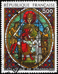 Ancient stained glass window from Strasbourg cathedral on stamp