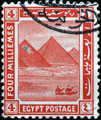 Egyptian pyramids on vintage postage stamp - obrazy, fototapety, plakaty