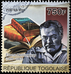 Ernest Hemingway and his books on postage stamp