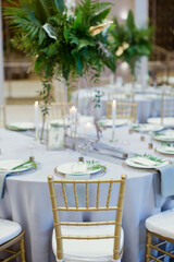 Celebration hall with gold tropical decor