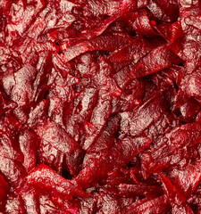 Red beets as a background.