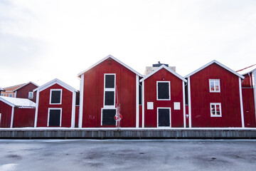 Hudiksvall, Sweden Rows of red warehouses on a canal in downtown.