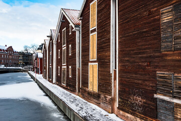 Hudiksvall, Sweden Rows of red warehouses on a canal in downtown.