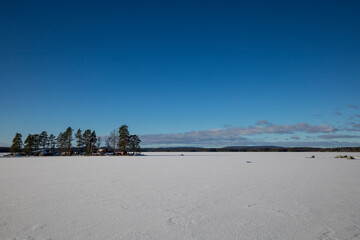 Norrbranningen, Sweden A frozen lake and island on a sunny days.