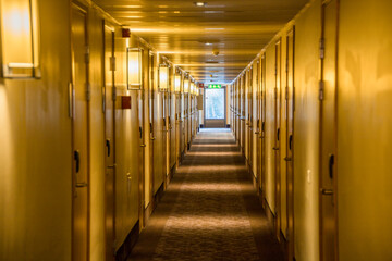 Fototapeta premium Sundsvall, Sweden A hotel corridor with doors to hotel rooms.