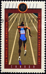 Sprinter running on canadian postage stamp